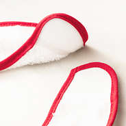 red outline baby bib up close