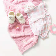 pink baby bow blanket flatlay