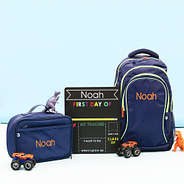 back to school chalkboard with navy bags