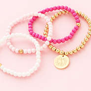 girls pink beaded bracelet stack flatlay