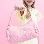 pink girls shoulder bag in hand