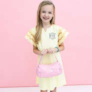 pink girls shoulder bag in hands