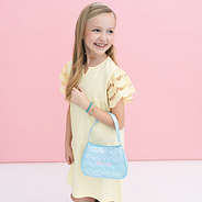 girl holding quilted shoulder bag