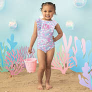 close up of girl wearing ruffle bathing suit in mermaid