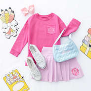 light pink girls twirl skort flatlay with crewneck sweatshirt