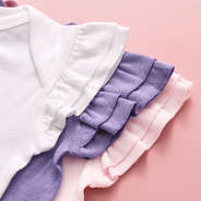 close up of flutter sleeve bodysuits in white light pink lavender