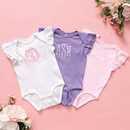 monogrammed flutter sleeve bodysuits in white light pink lavender