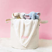 ivory baby blanket in basket