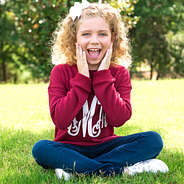 girl wearing burgundy monogrammed crewneck