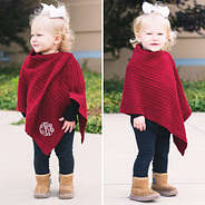 cute little girl in red poncho with boots