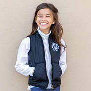 youth girl wearing black puffy vest