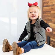 toddler girls herringbone vest with red bow and black top