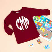 crimson pullover with puzzle pieces