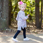 toddler girl walking while wearing fuzzy pullover