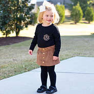 kids camel skirt with black tights and top