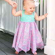 baby in mint and pink monogrammed dress
