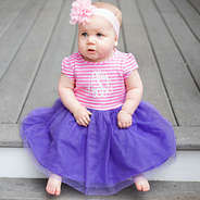 baby in pink and purple tule dress