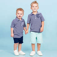 brothers wearing matching monogrammed polo shirts