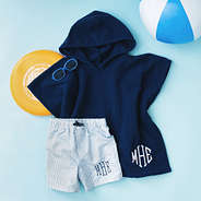 boys monogrammed toddler hooded towel poncho in navy with swim trunks