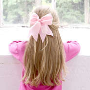 light pink hair bow in hair