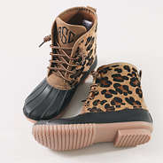 studio shot of leopard spots duck boots