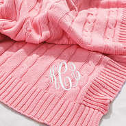 close up of pink personalized baby blanket.