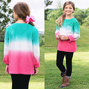 girl in mint and pink ombre sweatshirt