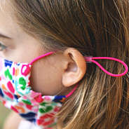 little girl in adjustable face mask