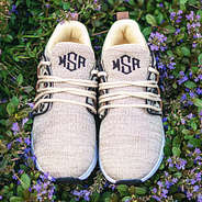 kids leopard sneakers in grass with flowers
