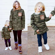 mom and son holding hands wearing camo sweatshirts