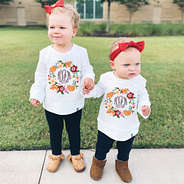 sisters in matching personalized crewneck sweatshirts