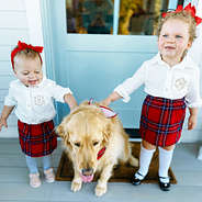 sisters wearing matching holiday outfits