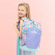 mint oopsie daisy backpack on addie