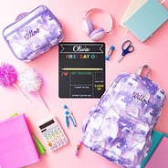 pastel unicorns basic backpack flatlay with lunch box