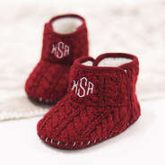 personalized crimson baby booties on blanket