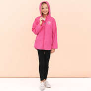 girl wearing hot pink monogrammed lightweight rain jacket with hoodie