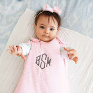 baby girl wearing pink wearable blanket