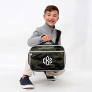 boy-with-camo-lunch-box-kneeling