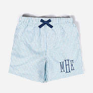 monogrammed kids swim trunks in navy seersucker