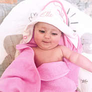 pink bows baby hooded bath towel on baby