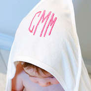baby girl wearing white monogrammed towel