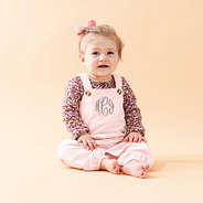 blush monogrammed overalls on baby