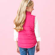 pink kids puffer vest on addie - back view