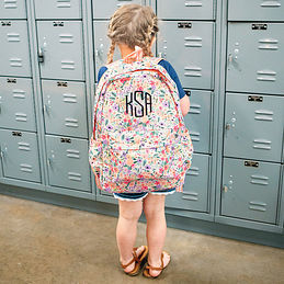 https://images.marleylilly.com/profiles/mlk-product-list/product/69914/vMY-coral-floral-kids-backpack-at-school.jpg